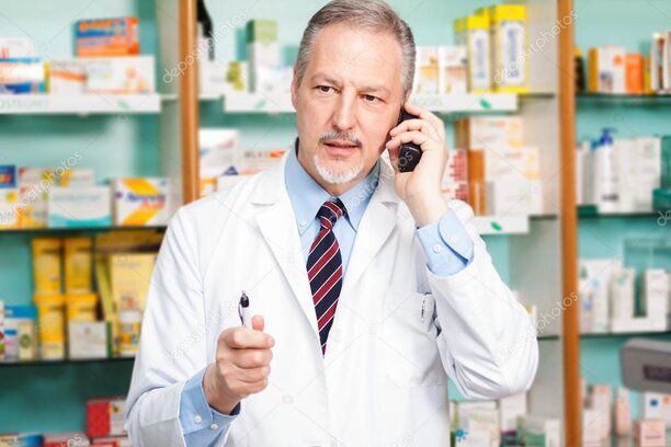 Senior reviewing prescription drug costs with a Medicare advisor.